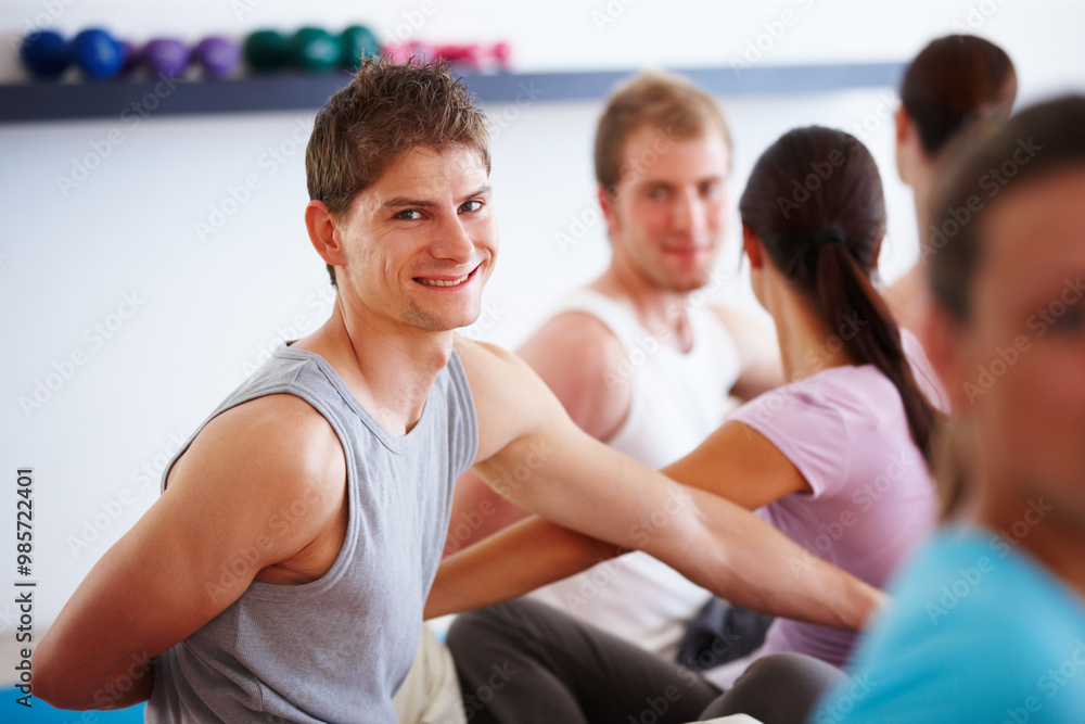 Fitness, yoga and portrait of man in class for teamwork, wellness and stretching for healthy body care. Support, friends and people at exercise club together for balance, mindfulness and workout