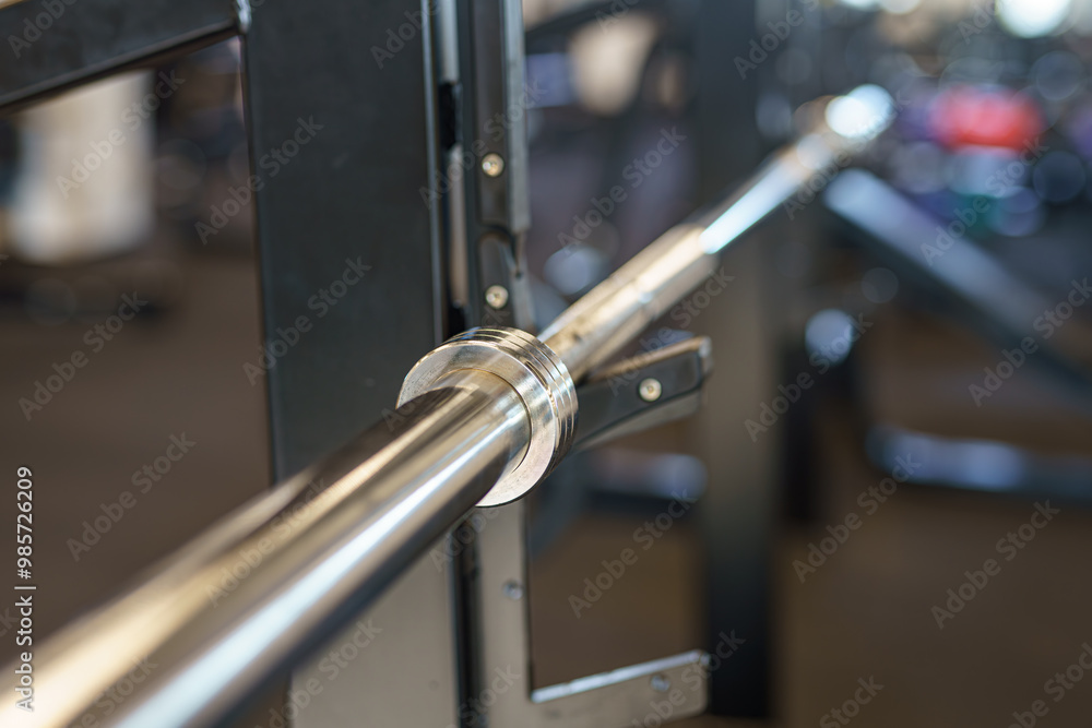 Barbell bar in the gym for fitness and bodybuilding. Barbell bar in the gym for fitness and bodybuilding.