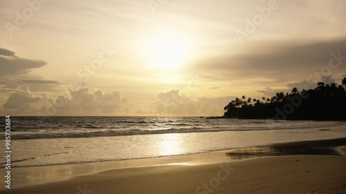 Tropical island beach shore at sunrise, beautiful color sea sunset Beautiful beach at sunset