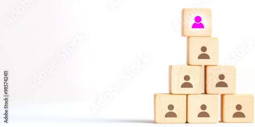 Connected people icons on wooden blocks symbolize teamwork and collaboration