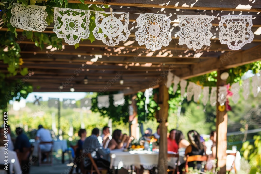 Naklejka premium Rustic Outdoor Wedding Reception Decorated with White Papel Picado Banners Under Wooden Canopy