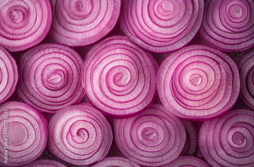 A close-up of sliced red onion highlighting the vibrant pink and purple hues