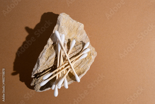 Bamboo cotton buds on a colored background. Biodegradable ear swabs. Eco product
 photo