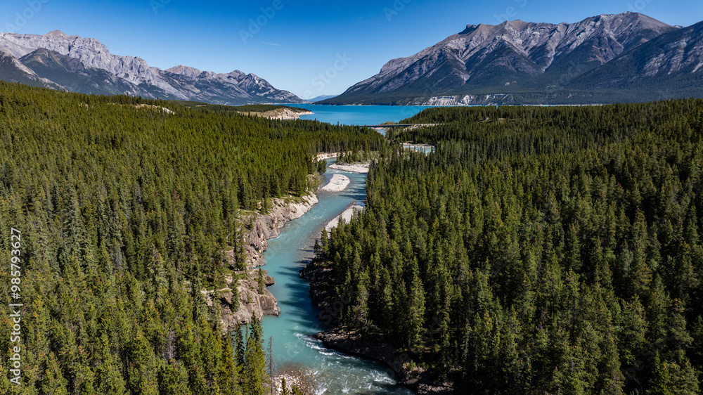 Canadian aerial landscape view along river course of Cline river with river mouth into North Saskatchewan River as well Abraham Lake and Rocky Mountains in background Canadian aerial landscape view along river course of Cline river with river mouth into North Saskatchewan River as well Abraham Lake and Rocky Mountains in background