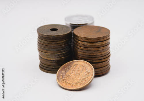 Stacked Japanese Coins on Clean White Background shoot on center angle 