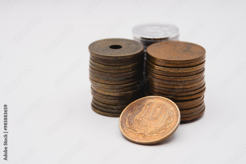 Stacked Japanese Coins on Clean White Background Stacked Japanese Coins on Clean White Background