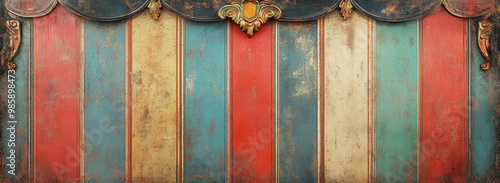 A weathered vintage circus podium with colorful striped wooden panels and ornate details, perfect for adding a touch of whimsy and nostalgia to your design projects.