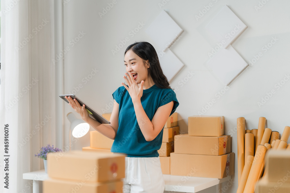 E-commerce Success: A young entrepreneur, with a vibrant and joyful expression, celebrates a major online sales milestone, surrounded by a mountain of shipping boxes, symbolizing her thriving business E-commerce Success: A young entrepreneur, with a vibrant and joyful expression, celebrates a major online sales milestone, surrounded by a mountain of shipping boxes, symbolizing her thriving business