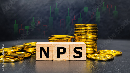 The inscription NPS text on wooden cubes with stack of coin on black background with stock market graph. Business profitability success growth profitability analytics. Business and financial concept.