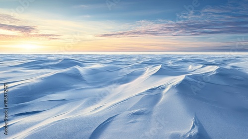 Windswept Snowdrifts Under a Cloudy Sunset Sky photo