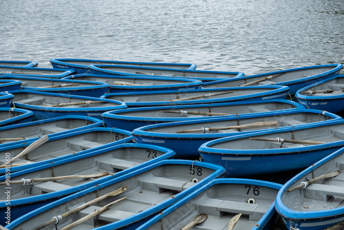 Wallpaper Mural Boats with oars anchored on calm river water, Kyoto Japan Torontodigital.ca