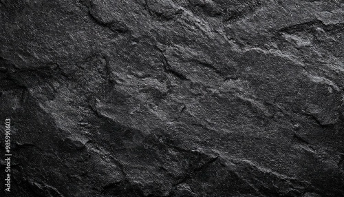 Black or dark gray rough grainy stone texture background