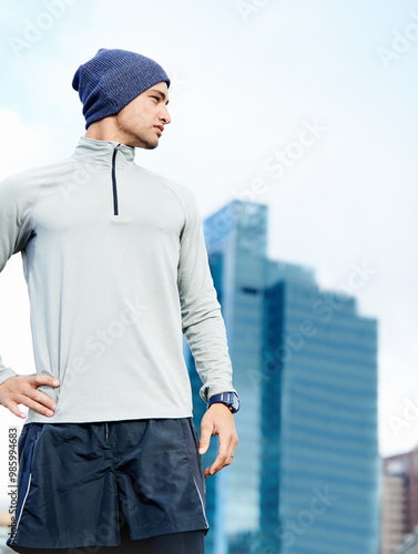 Break, thinking and man in city for running workout with race, marathon or challenge training. Sports, fitness and healthy male athlete in urban town with cardio exercise for endurance or morning jog