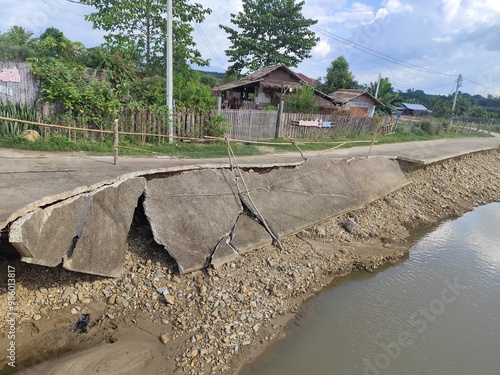 The concrete road collapsed into the river.