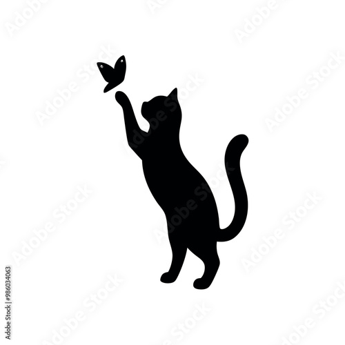 a cat standing on its hind legs with its front paws up in the air. The cat appears to be reaching up towards a small butterfly that is flying in front of it