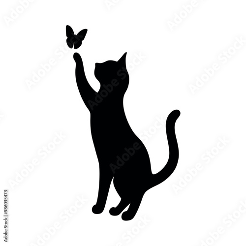 a cat standing on its hind legs with its front paws up in the air. The cat appears to be reaching up towards a small butterfly that is flying in front of it