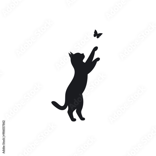 a cat standing on its hind legs with its front paws up in the air. The cat appears to be reaching up towards a small butterfly that is flying in front of it