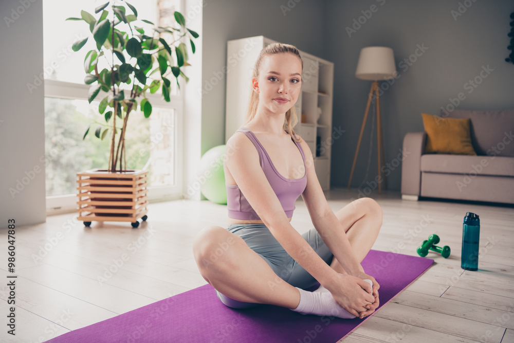 Photo of adorable active girl wearing sportswear yoga exercises morning house home indoors Photo of adorable active girl wearing sportswear yoga exercises morning house home indoors