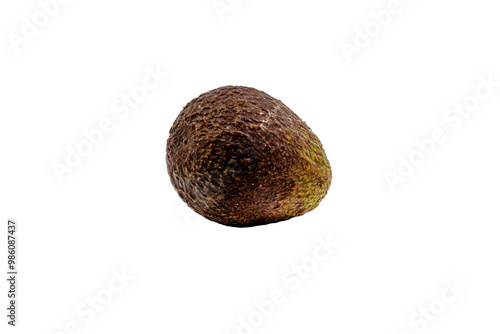 A brown avocado sits on a white background. The avocado is ripe and ready to eat. Concept of freshness and natural beauty