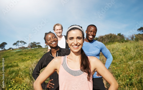 People, portrait and together with happiness on mountain or hill for support, diversity or exercise. Group, freedom and excited in workout, health club or sport team for outdoor adventure or training photo