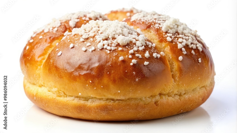 Fluffy, golden-brown sweet bun topped with sugar crystals, isolated on a white background Fluffy, golden-brown sweet bun topped with sugar crystals, isolated on a white background