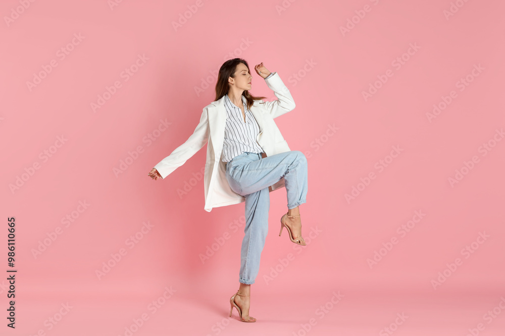 Beautiful woman in stylish white jacket on pink background Beautiful woman in stylish white jacket on pink background