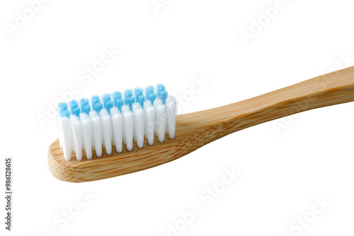 Ecoconscious bamboo toothbrush with soft nylon bristles, earthfriendly design, on solid white background, single object., photo