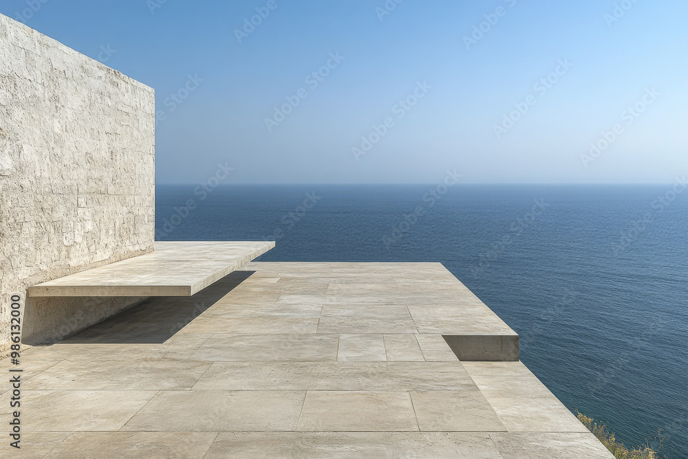 Fototapeta premium Modern concrete terrace overlooking tranquil sea at noon with clear sky and minimalistic design