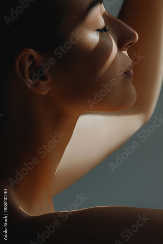 Gentle beautiful woman posing in sunlight. Morning mood and lifestyle