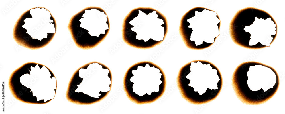 Burnt holes in a piece of paper Burnt holes in a piece of paper