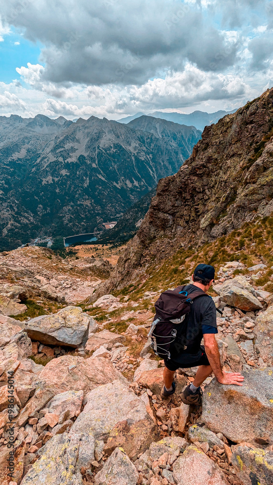 Fototapeta premium Pyrenees in its splendor: Traverse Argualas Peak and Algas Peak, with stunning views of the Ibón de Pondiellos and the majestic Pico Infiernos in the Tena Valley, Panticosa.