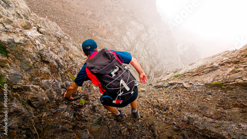 Extreme adventure in the Pyrenees: Mountaineer climbing Pico Algas and Pico Argualas, surrounded by majestic peaks such as Garmo Negro and Pico Arnales in the Tena Valley, Panticosa.  photo