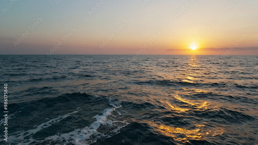 Blurred bokeh of a sunrise over a calm ocean Blurred bokeh of a sunrise over a calm ocean