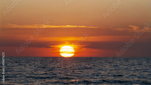 Blurred bokeh of a sunrise over a calm ocean