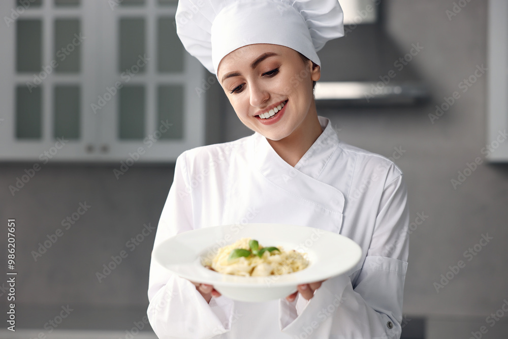 Professional chef with delicious pasta in kitchen Professional chef with delicious pasta in kitchen