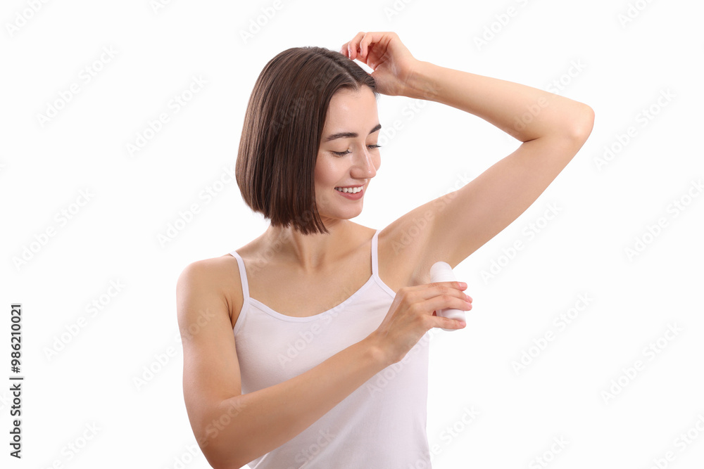Smiling woman applying roll-on deodorant on white background Smiling woman applying roll-on deodorant on white background