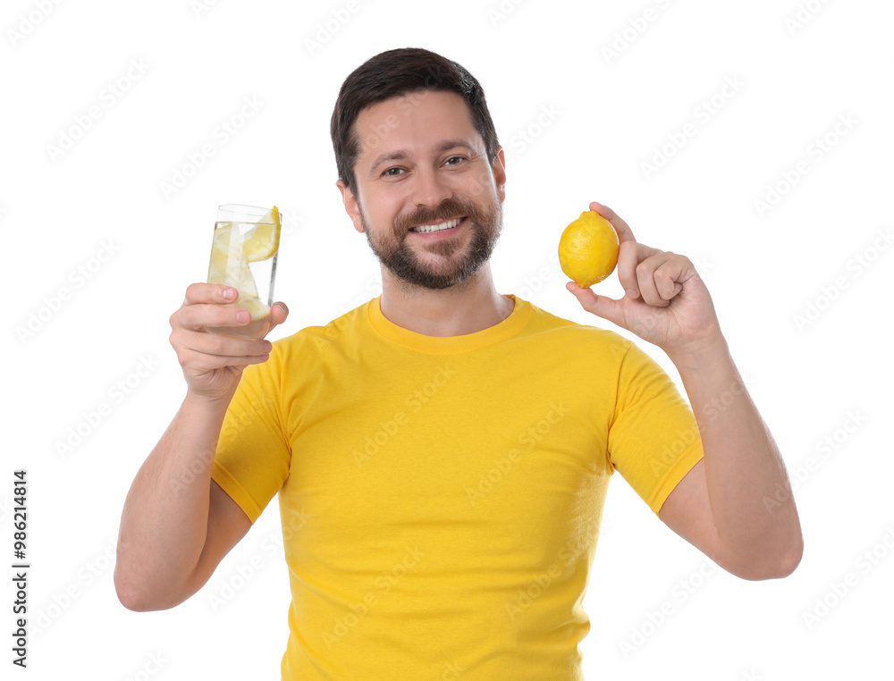 Happy man holding glass of water with lemon on white background Happy man holding glass of water with lemon on white background