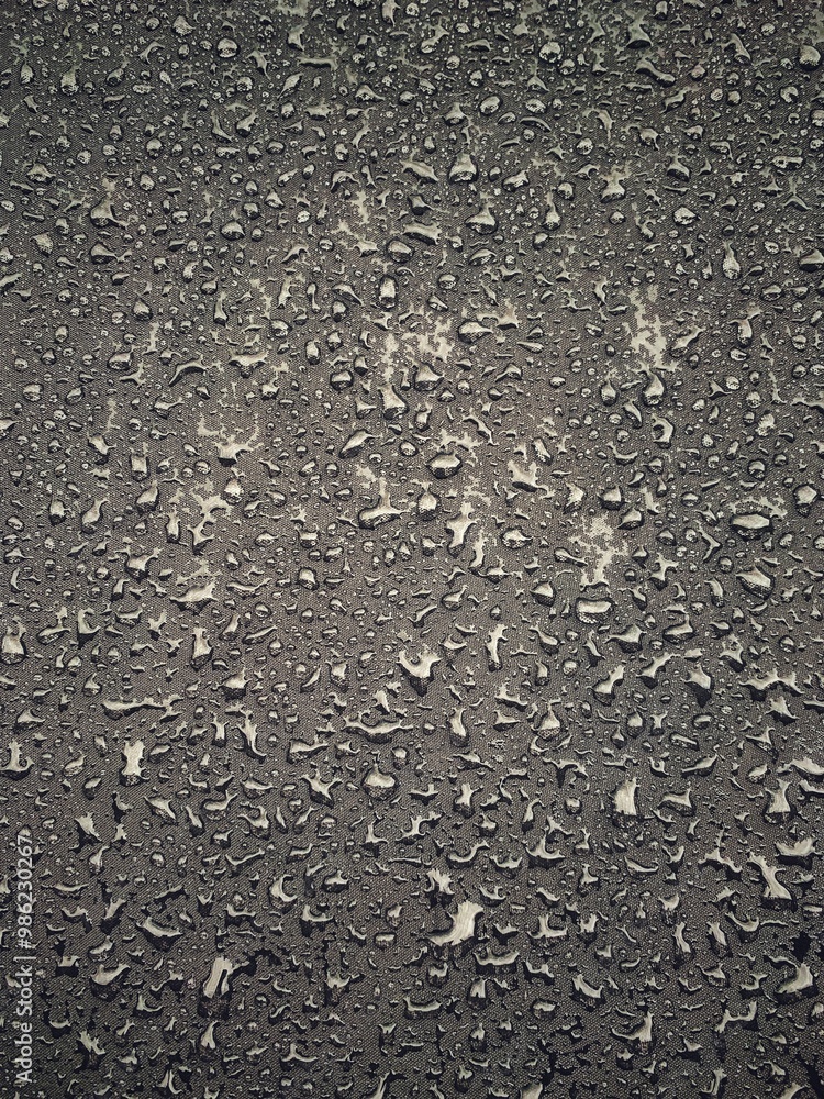 Water drops on black surface. Water droplets on dark background. Water droplets concept. Water drops on a black background. Banner with raindrops. Top view. Water drops on black surface. Water droplets on dark background. Water droplets concept. Water drops on a black background. Banner with raindrops. Top view.