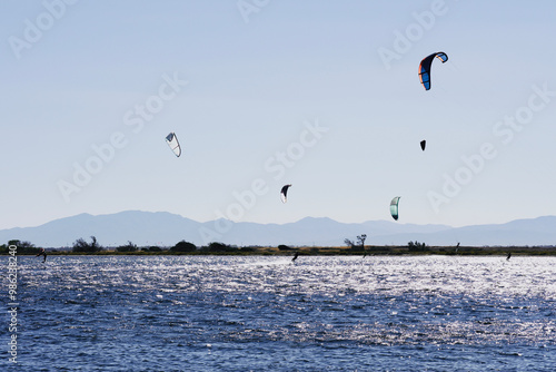 People kite surfing on the Mediterranean coast. photo