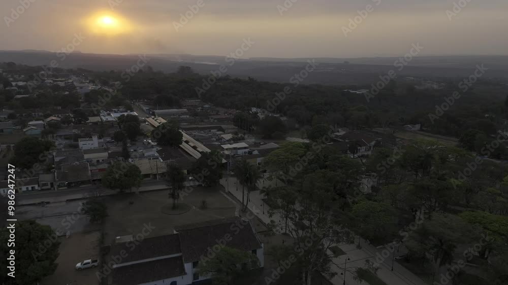 Drone flies into sunset with wildfire smoke billowing below Drone flies into sunset with wildfire smoke billowing below