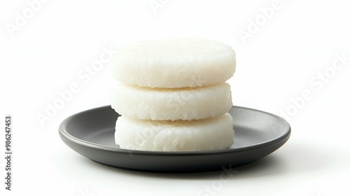 Delicious Baekseolgi Steamed White Rice Cakes on a Plate. photo