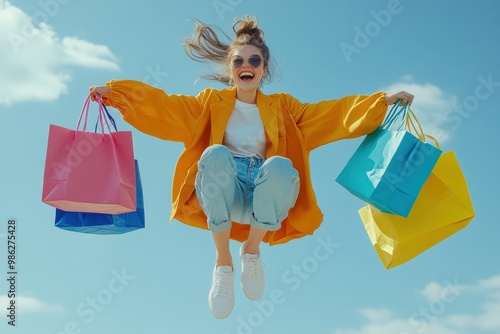 Wallpaper Mural Young woman wearing colorful cloth in modern style holding colorful shopping bags jumping with happy smile.  Torontodigital.ca