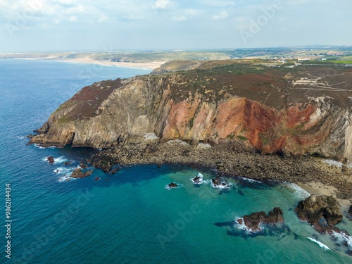 An aerial view of the coast of the atlantic ocean, St Agnes Heritage Coast in Cornwall, UK photo