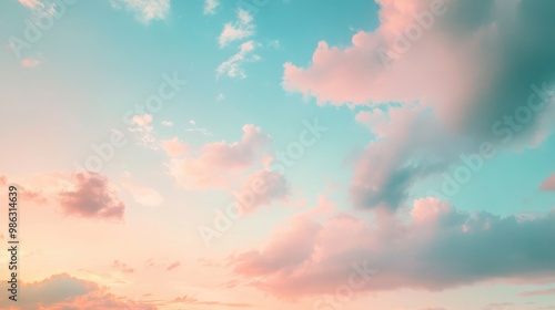 A pastel-colored sky just after sunset, with soft tones of blue, pink, and peach photo