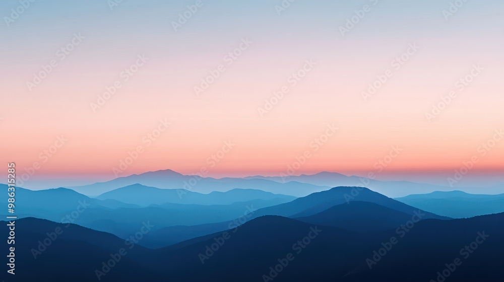 Fototapeta premium Soft gradient of blue and peach in the sky just before sunrise