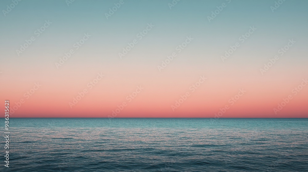 Naklejka premium Clear sky at twilight with light pastel pink and orange tones near the horizon
