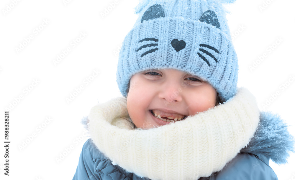 Young child smiles warmly in winter attire while enjoying snowy outdoor fun in bright daylight Young child smiles warmly in winter attire while enjoying snowy outdoor fun in bright daylight