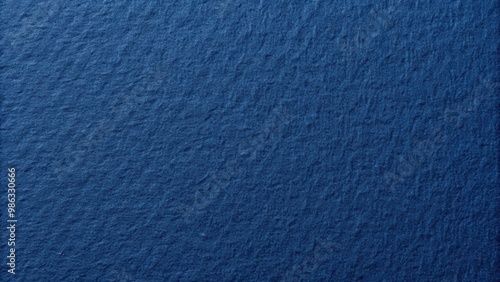 Closeup of the texture of navy blue paper resembling dense cardboard photo