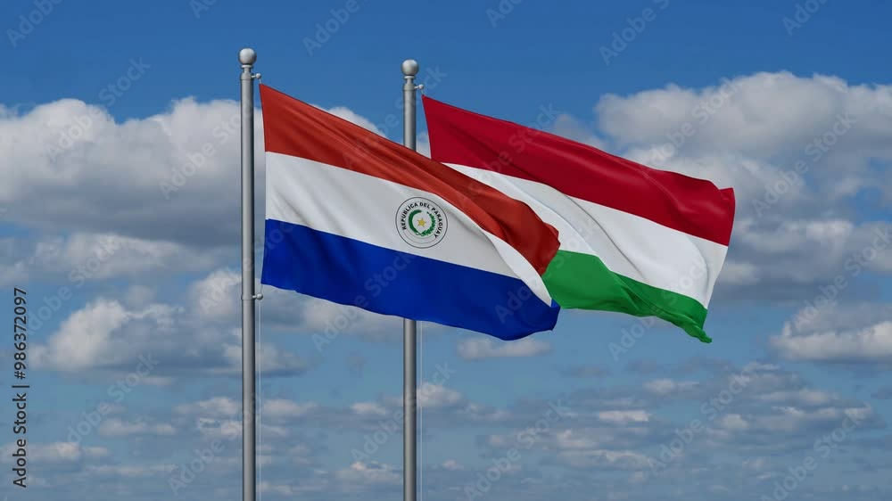 Hungary and Paraguay flags flying together, video concept of the relationship, two country relations concept Hungary and Paraguay flags flying together, video concept of the relationship, two country relations concept