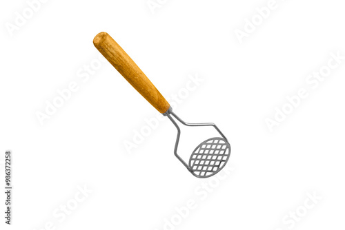 potato masher kitchen equipment tool on yellow background. photo